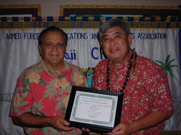 Lindo (l) recognizes the October AFCEAN of the Month, Melvin Ing, business development, CACI International.